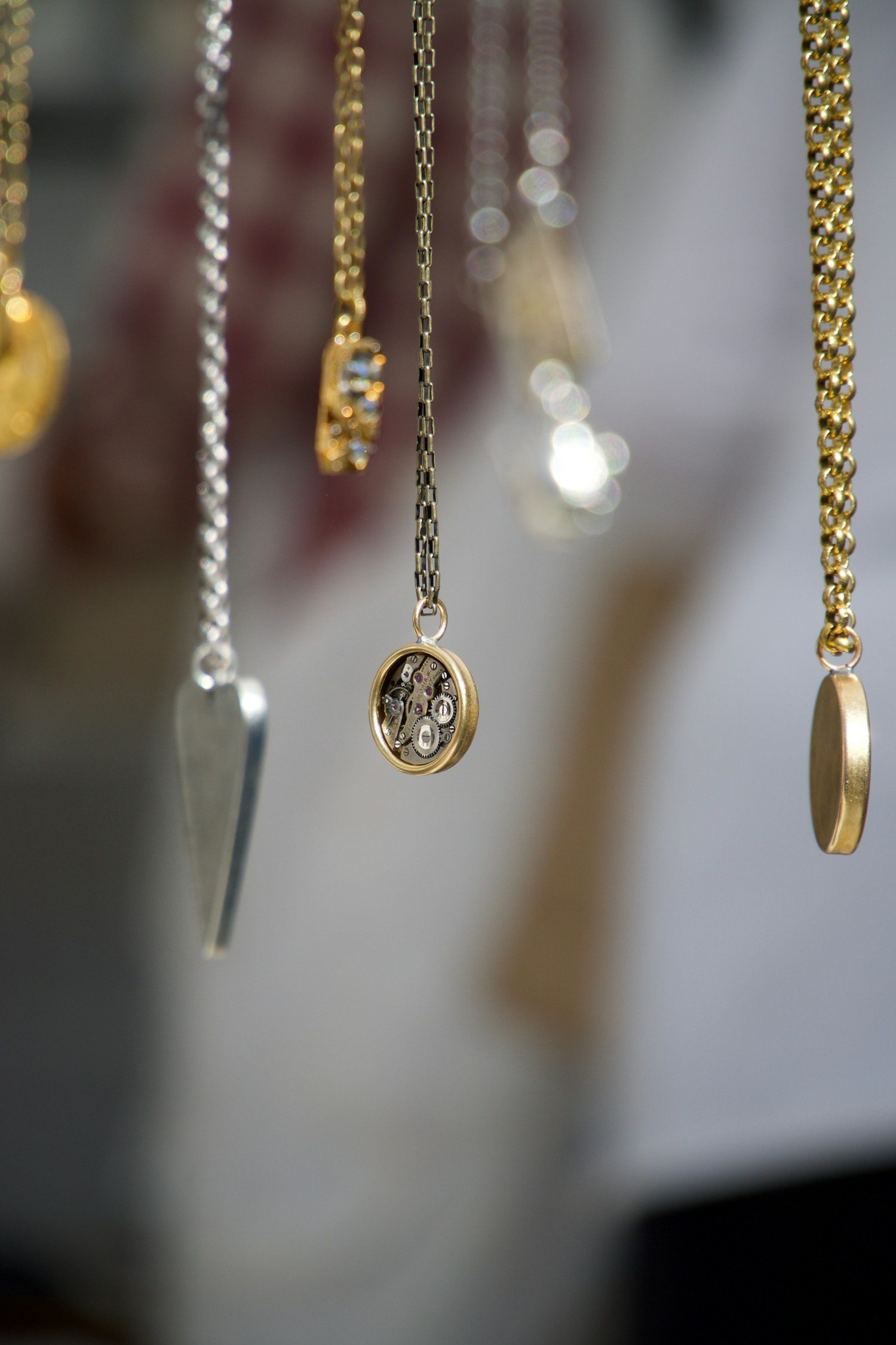 A jeweller carefully crafting a fine piece by hand